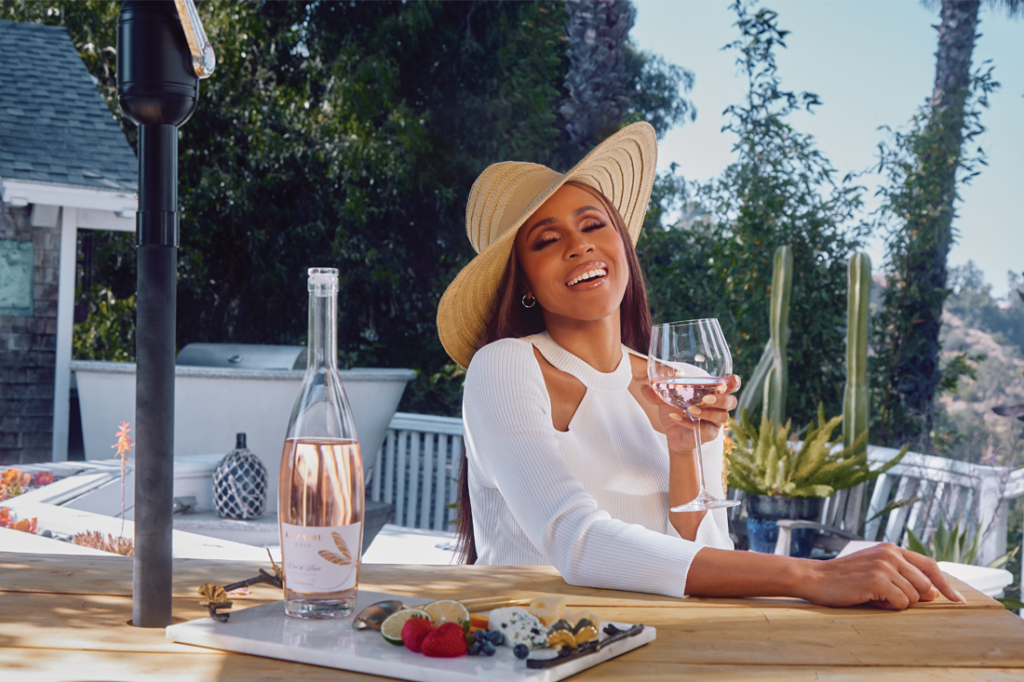 Deborah Cox at an outdoor patio table.