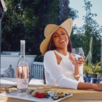 Deborah Cox at an outdoor patio table.