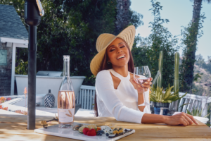 Deborah Cox at an outdoor patio table.
