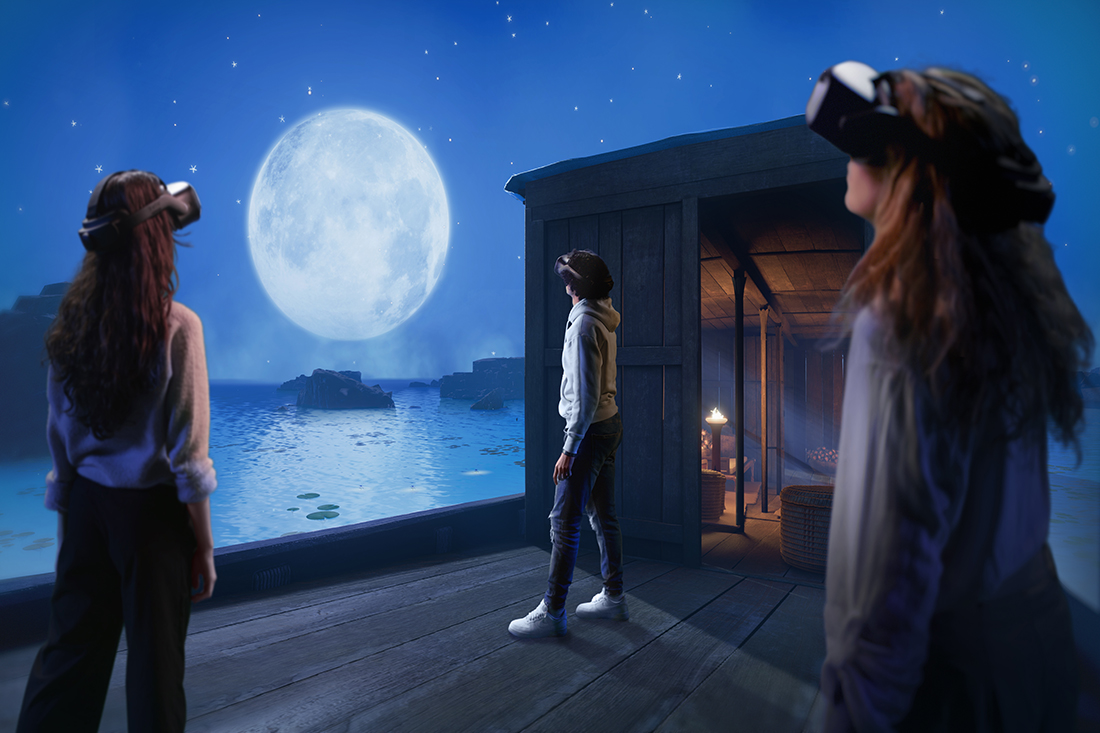 Three individuals experience a virtual landscape in a virtual reality expedition