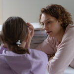 upset teenager with their mother