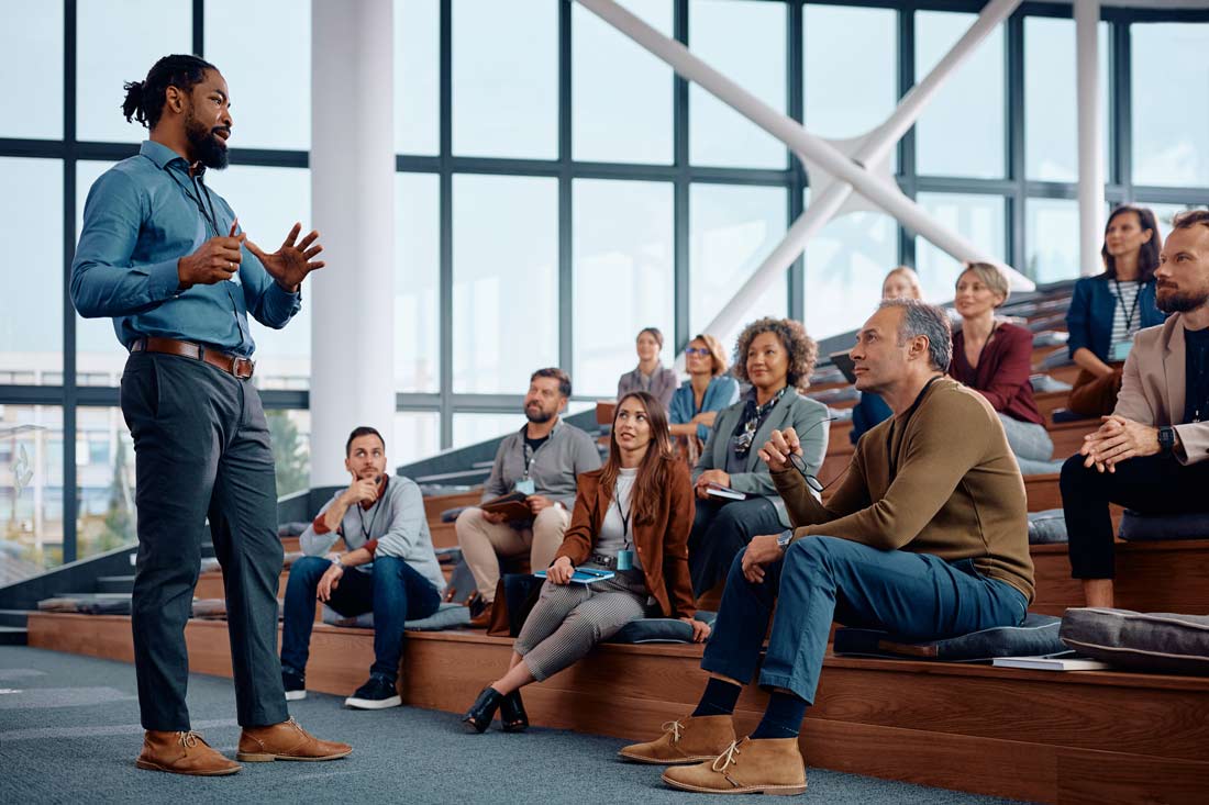 Leader at work giving a talk to colleagues