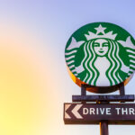 Starbucks drive thru sign against evening sky