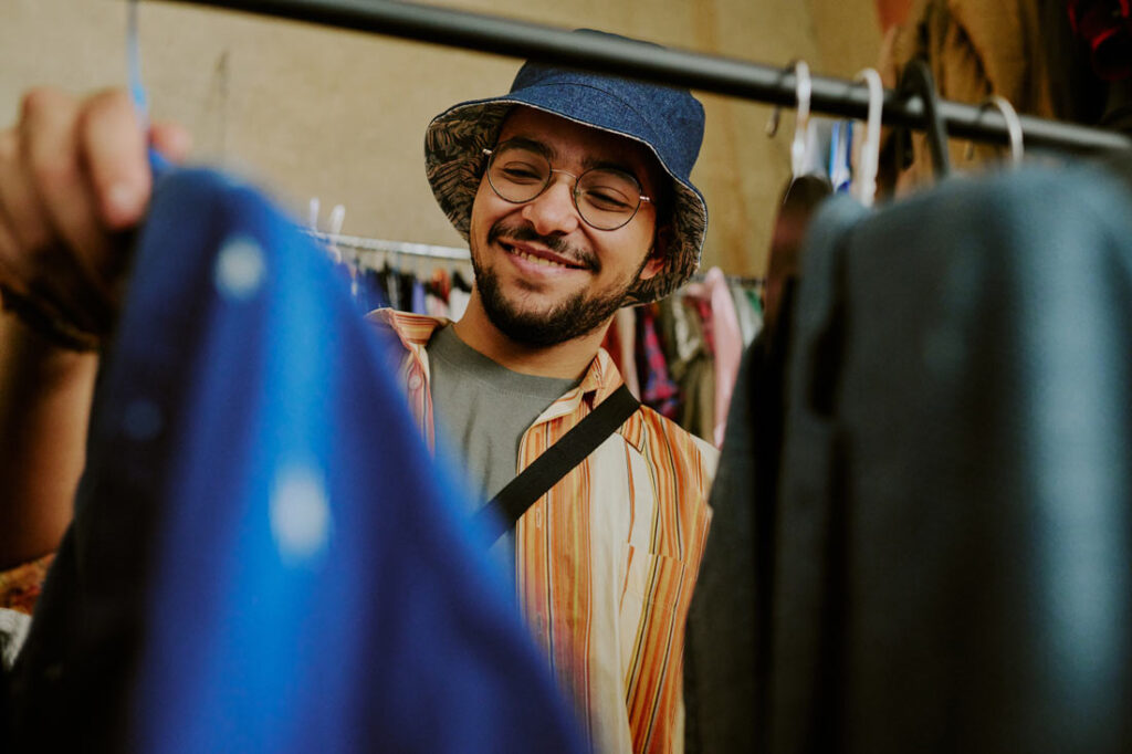 A young man thrift shopping