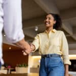 Woman shaking hands at job interview