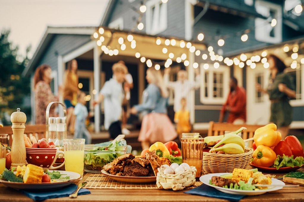 Guests enjoy themselves outside at an at-home party