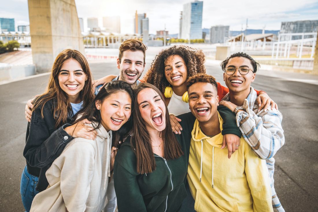 a group of Gen Z friends smiling together