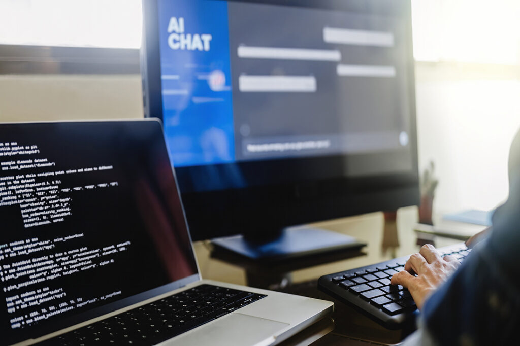 A programmer using generative artificial intelligence for software development inside an office