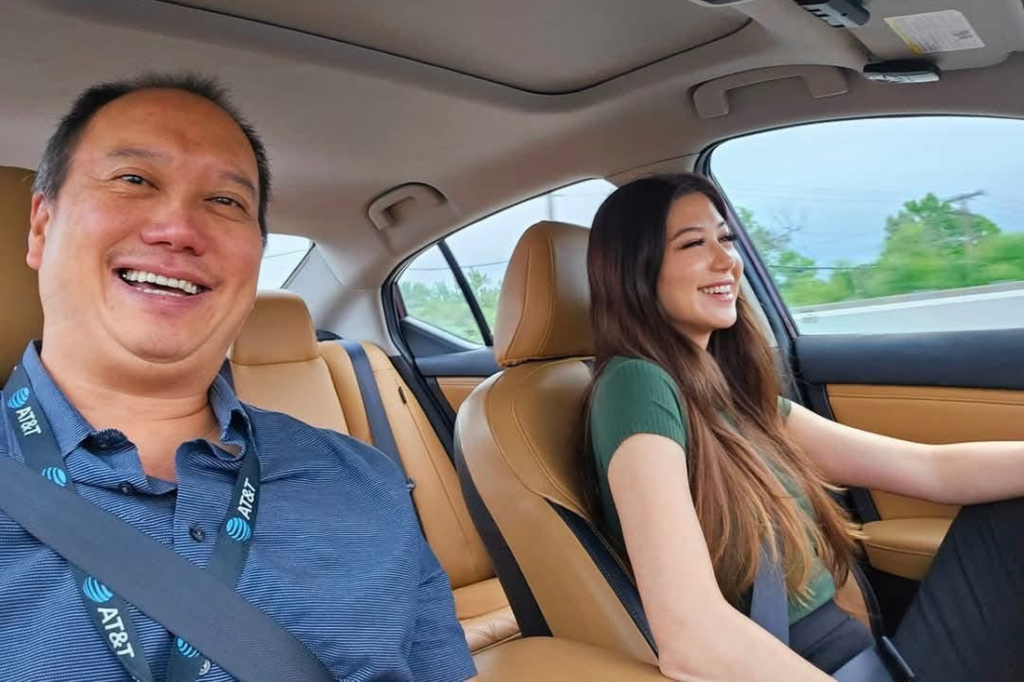 Nicole and Peter Wen in a car together.