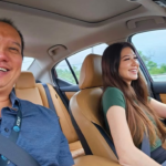 Nicole and Peter Wen in a car together.