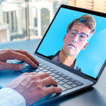 Businessman hands typing on laptop, man face hologram and glowing biometric scanning on computer screen
