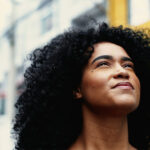 Close-up of woman looking up