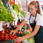 female in work uniform in supermarket