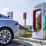Electric vehicle charging at a Tesla station