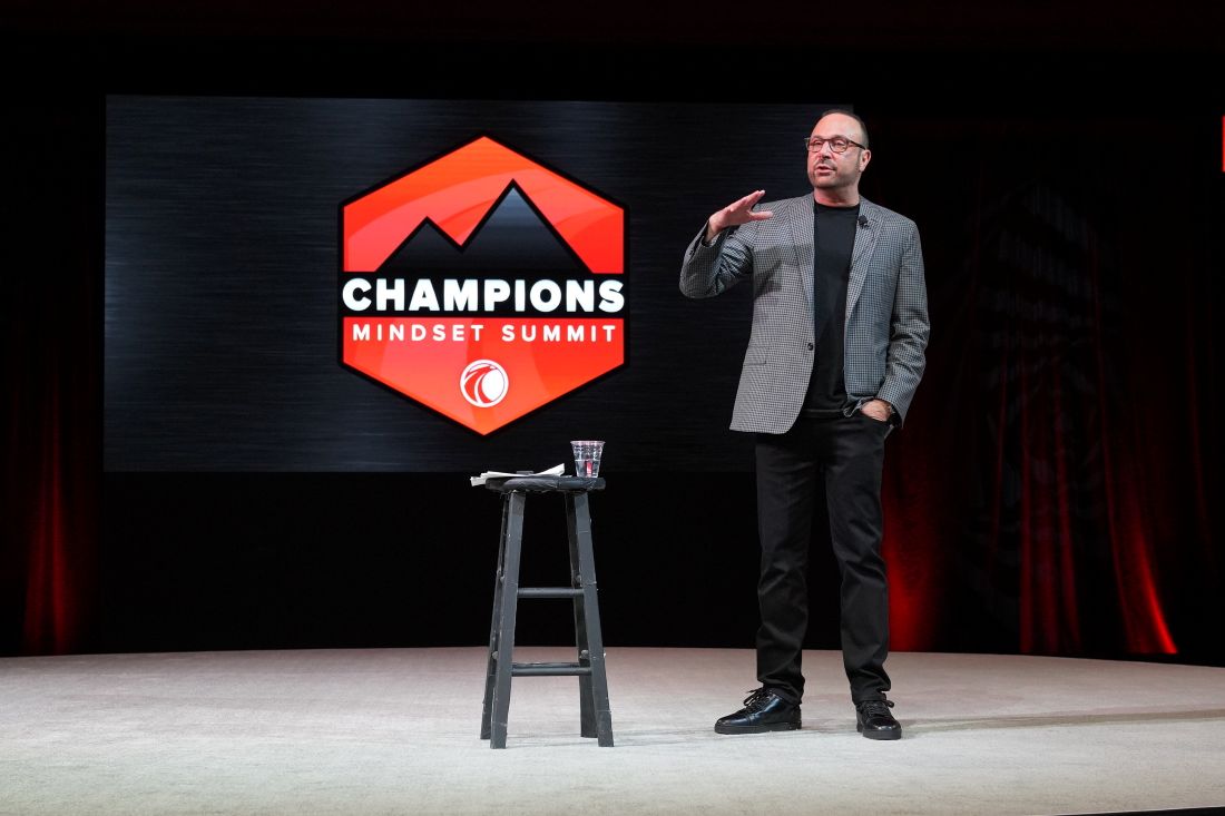 Matt Ebert giving a speech at the Champions Mindset Summit