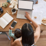 baby and woman with laptop with screen