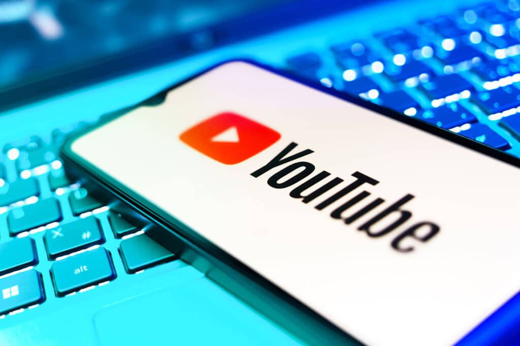 Smartphone on surface showing Youtube logo