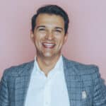 Rory Vaden headshot with pink backdrop