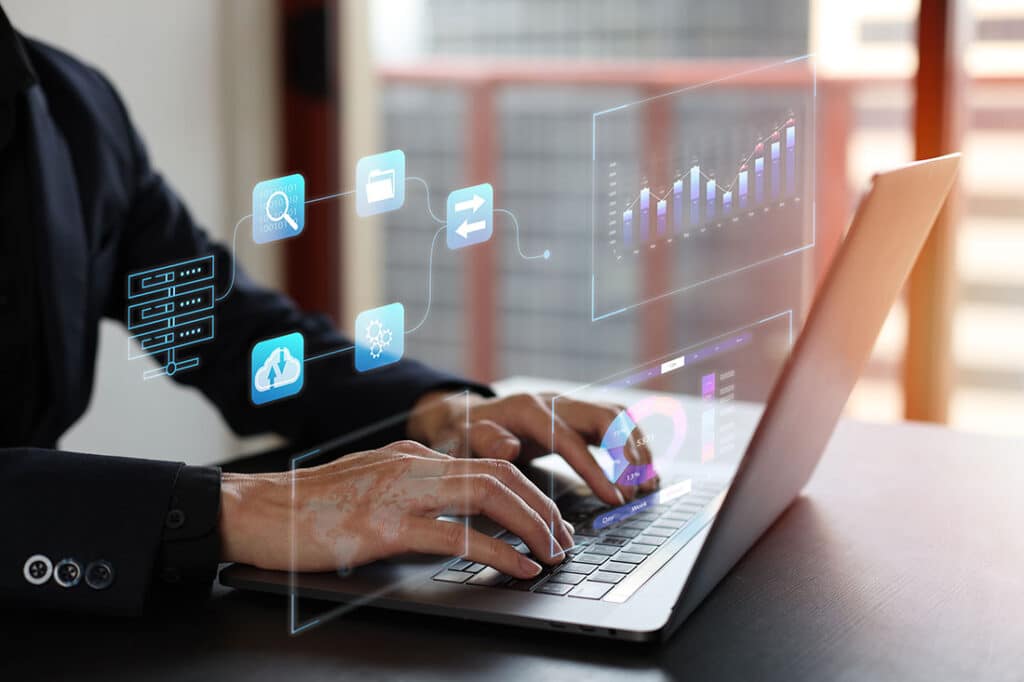 Business man Analytics and Data Management System on computer