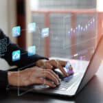 Business man Analytics and Data Management System on computer