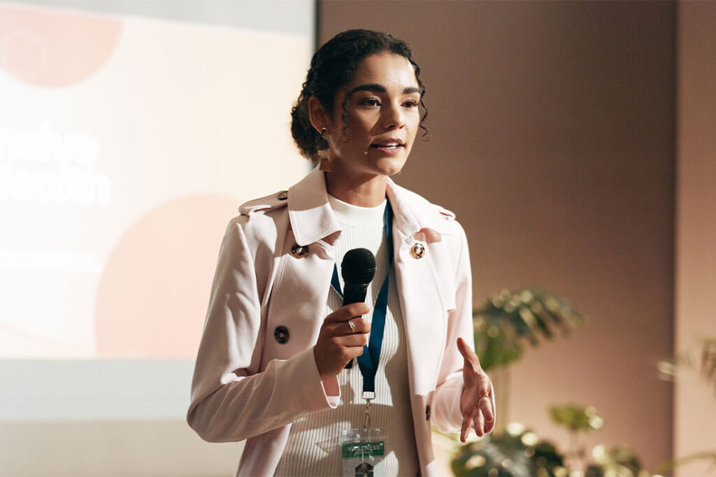 Business woman speaking at conference