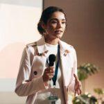Business woman speaking at conference