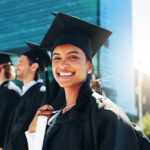 Graduate student smiling with certificate