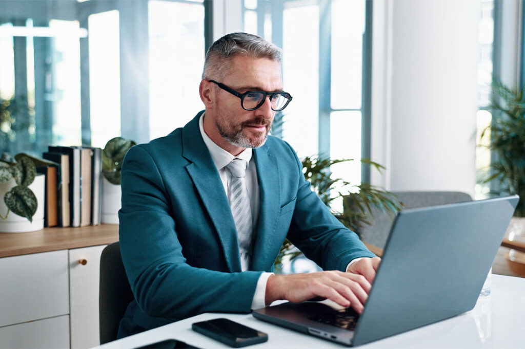 Man in business suit on computer