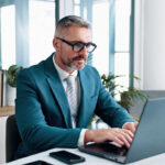 Man in business suit on computer