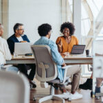 Group of business people engaged in a lively discussion and brainstorming session